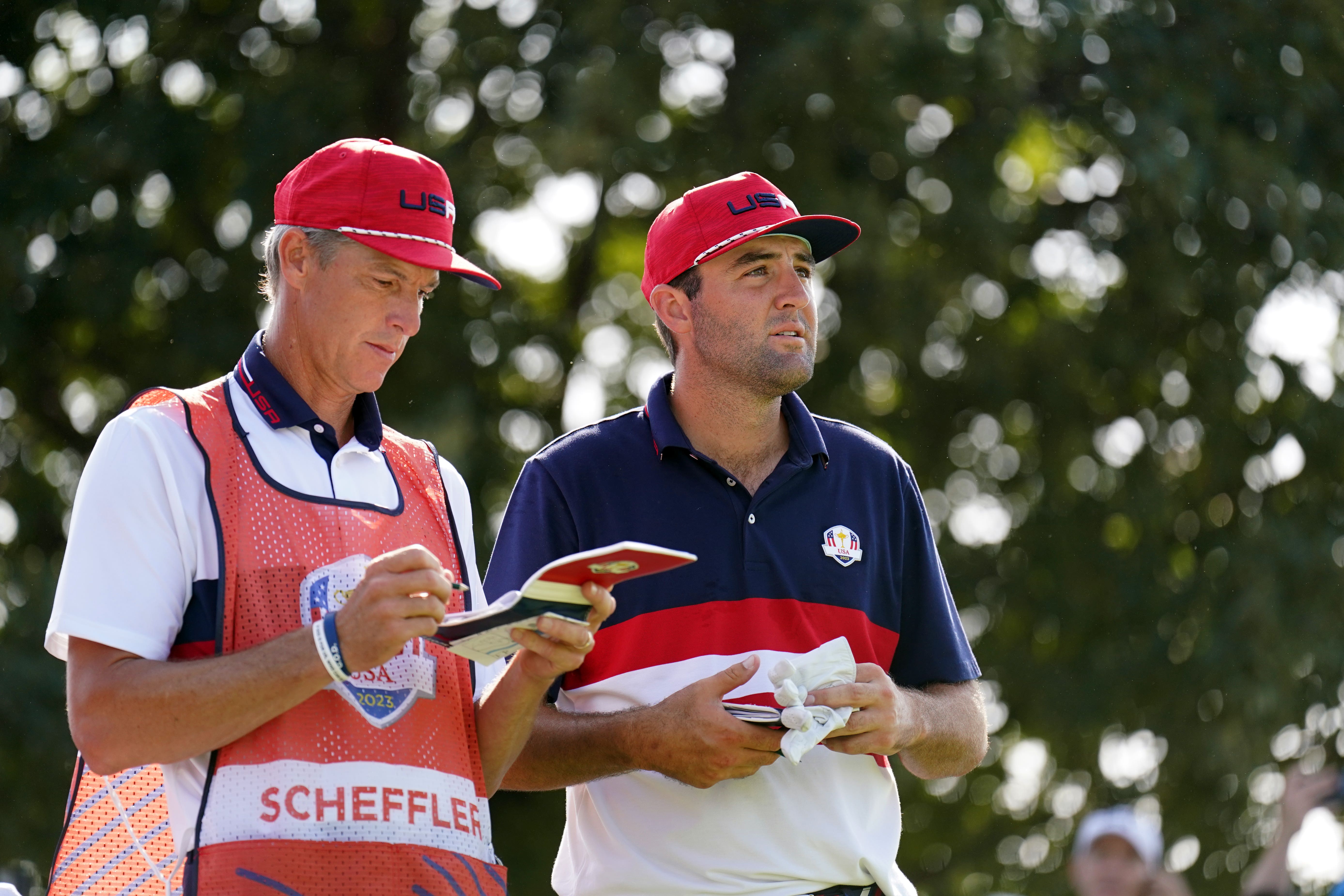 Caddie Ted Scott, left, will attend his daughter’s high school graduation on Saturday rather than work for Scottie Scheffler at the US PGA (Zac Goodwin/PA)