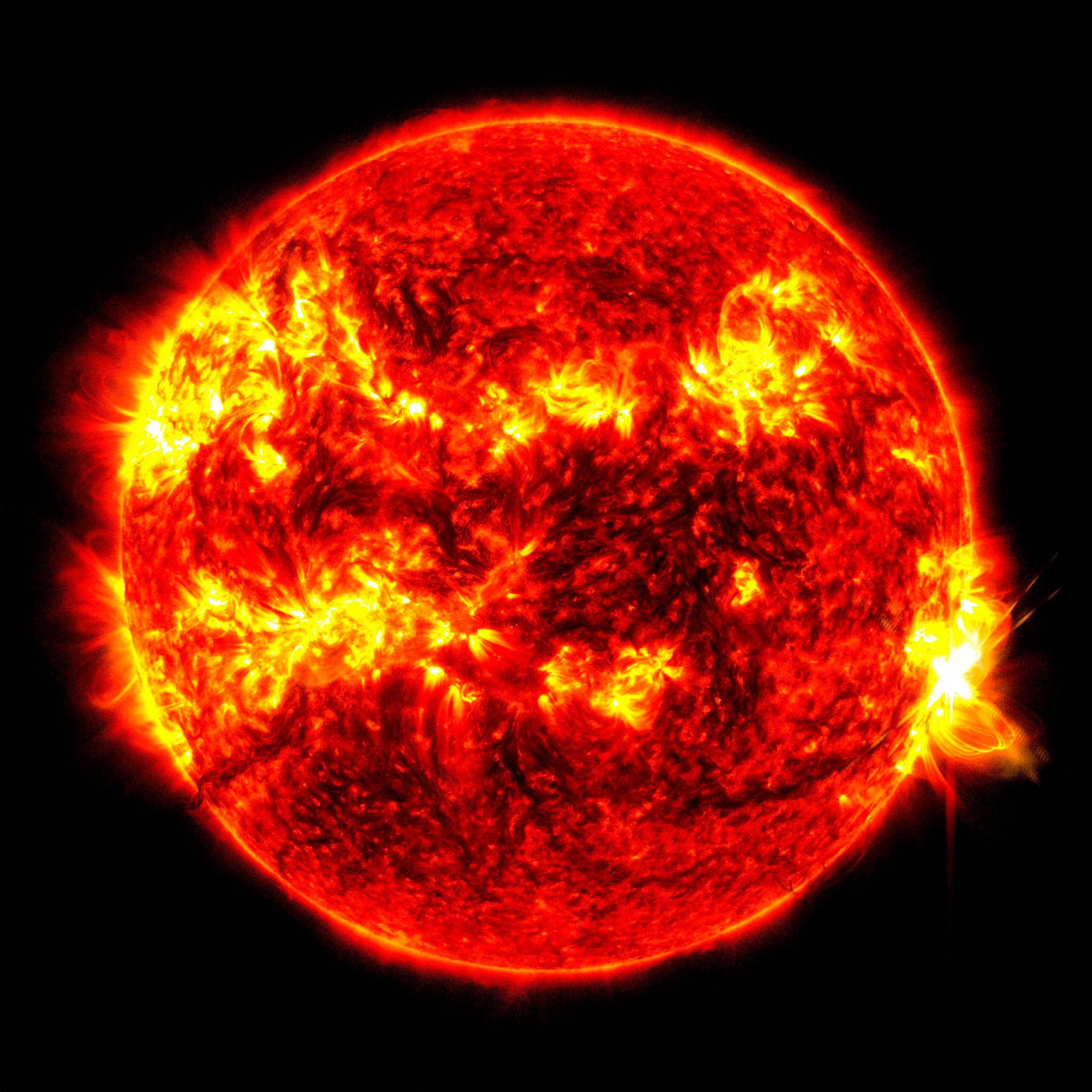 This image provided by Nasa’s Solar Dynamics Observatory shows a solar flare spewing from the right side of the Sun