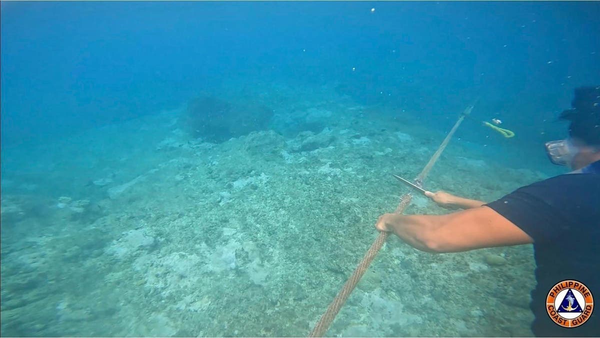 Filipino activists and fishermen sail in 100-boat flotilla to disputed shoal guarded by China