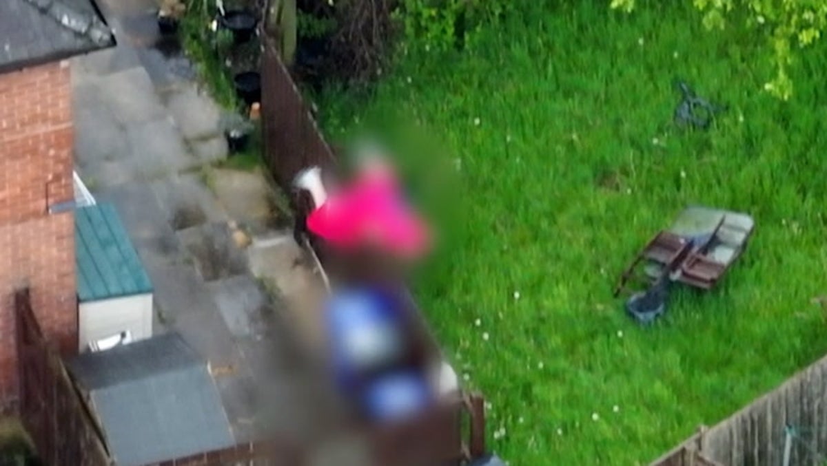 Drug dealing suspect in dressing gown hops over fence during police chase