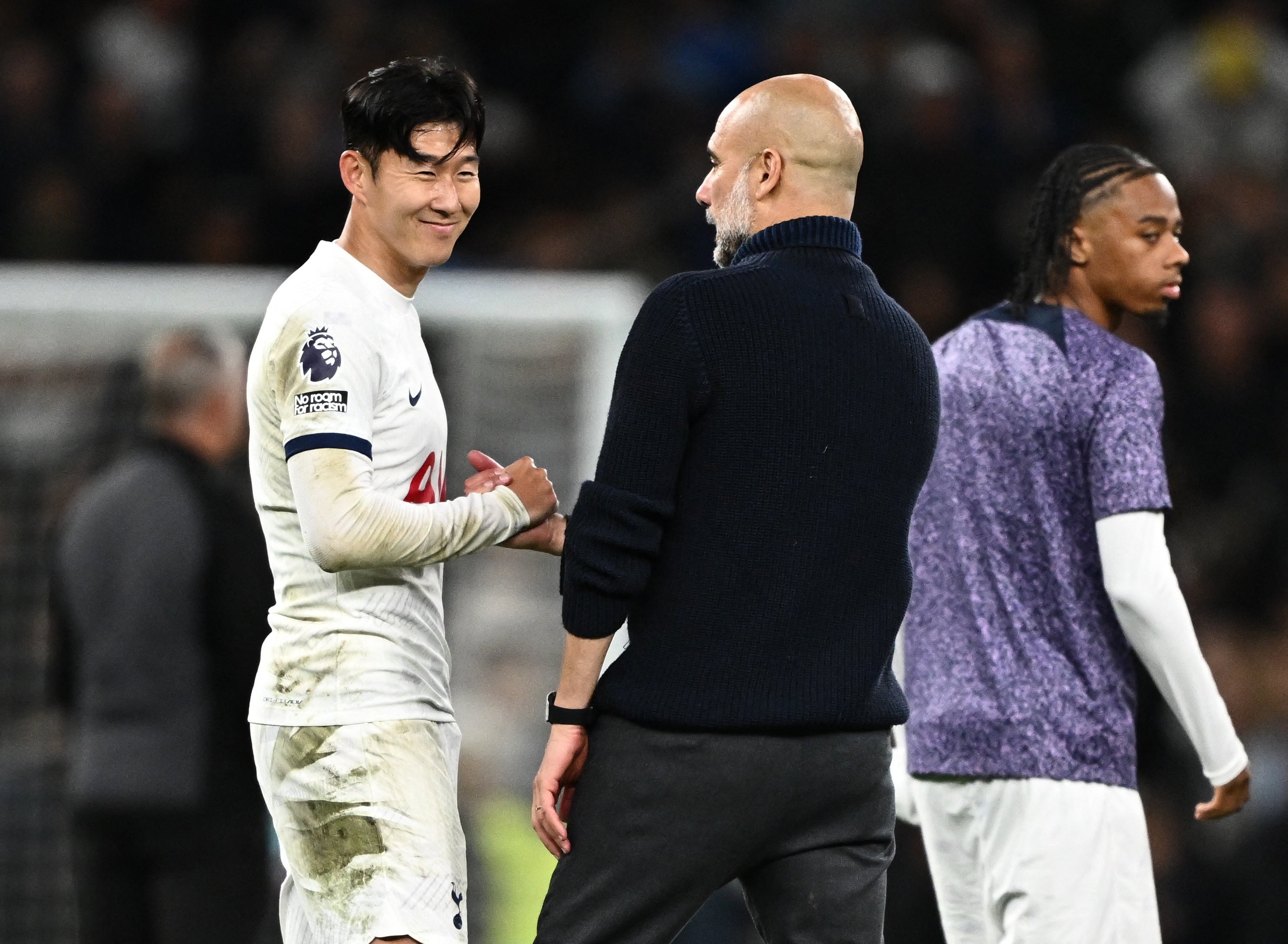 Son shares a handshake with Pep Guardiola at full-time