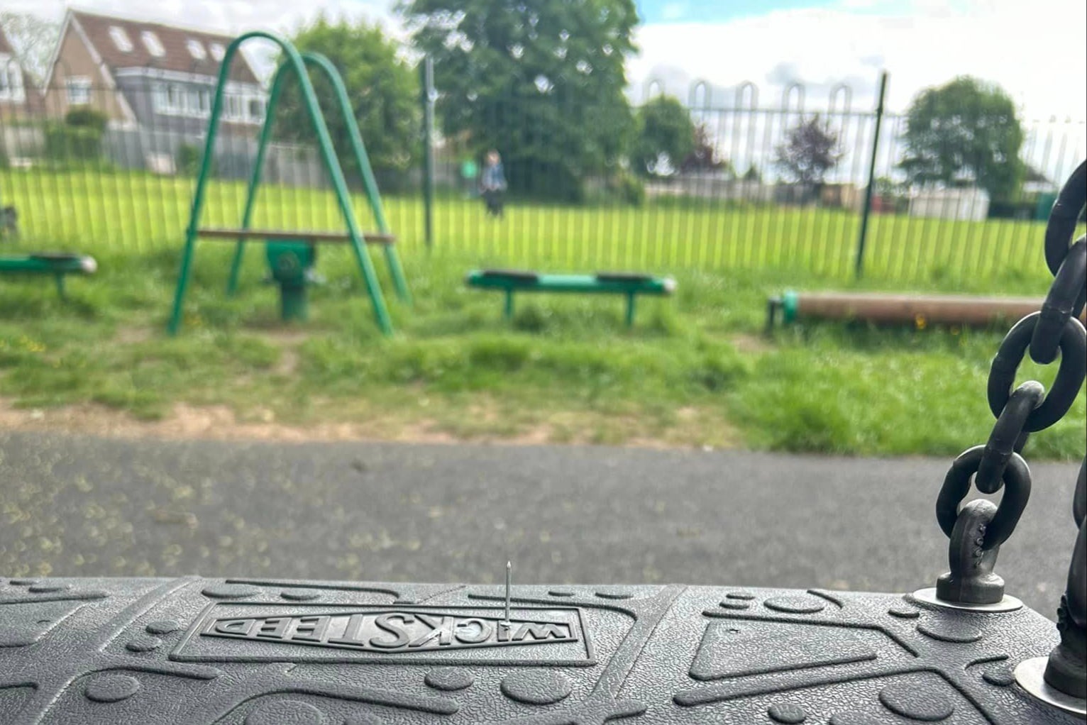 A nail sticks out of the swings that a young girl was about to be lowered on to