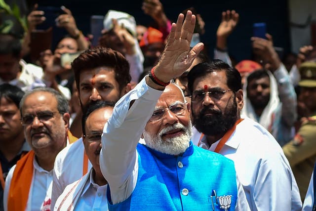 <p>India’s prime minister Narendra Modi (C), surrounded by other party leaders and MPs including home minister Amit Shah and Uttar Pradesh chief minister Yogi Adityanath, greets supporters after filing nomination papers on 14 May 2024 in Varanasi</p>