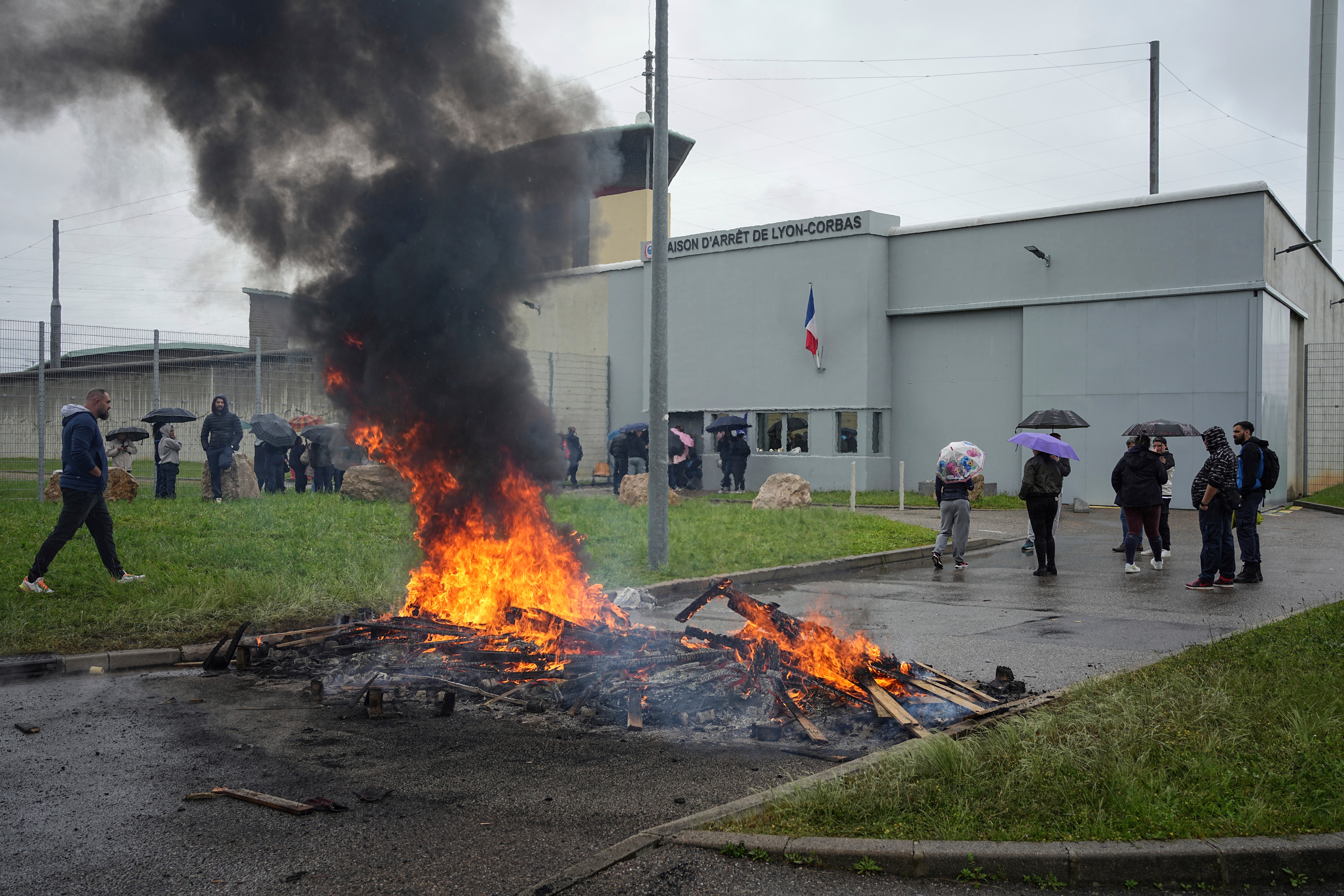 Prison workers protest outside the Corbas prison, Lyon, on Wednesday