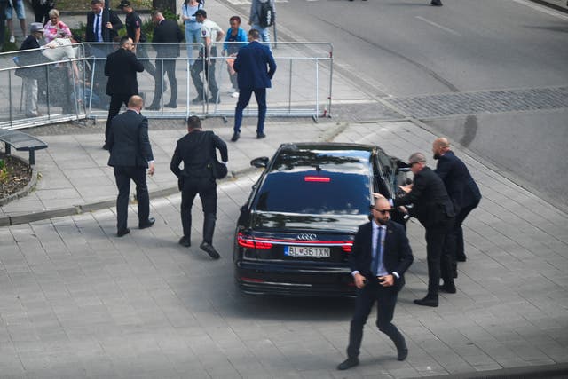 <p>Security guards react at the scene of a shooting incident of Slovak PM Robert Fico</p>