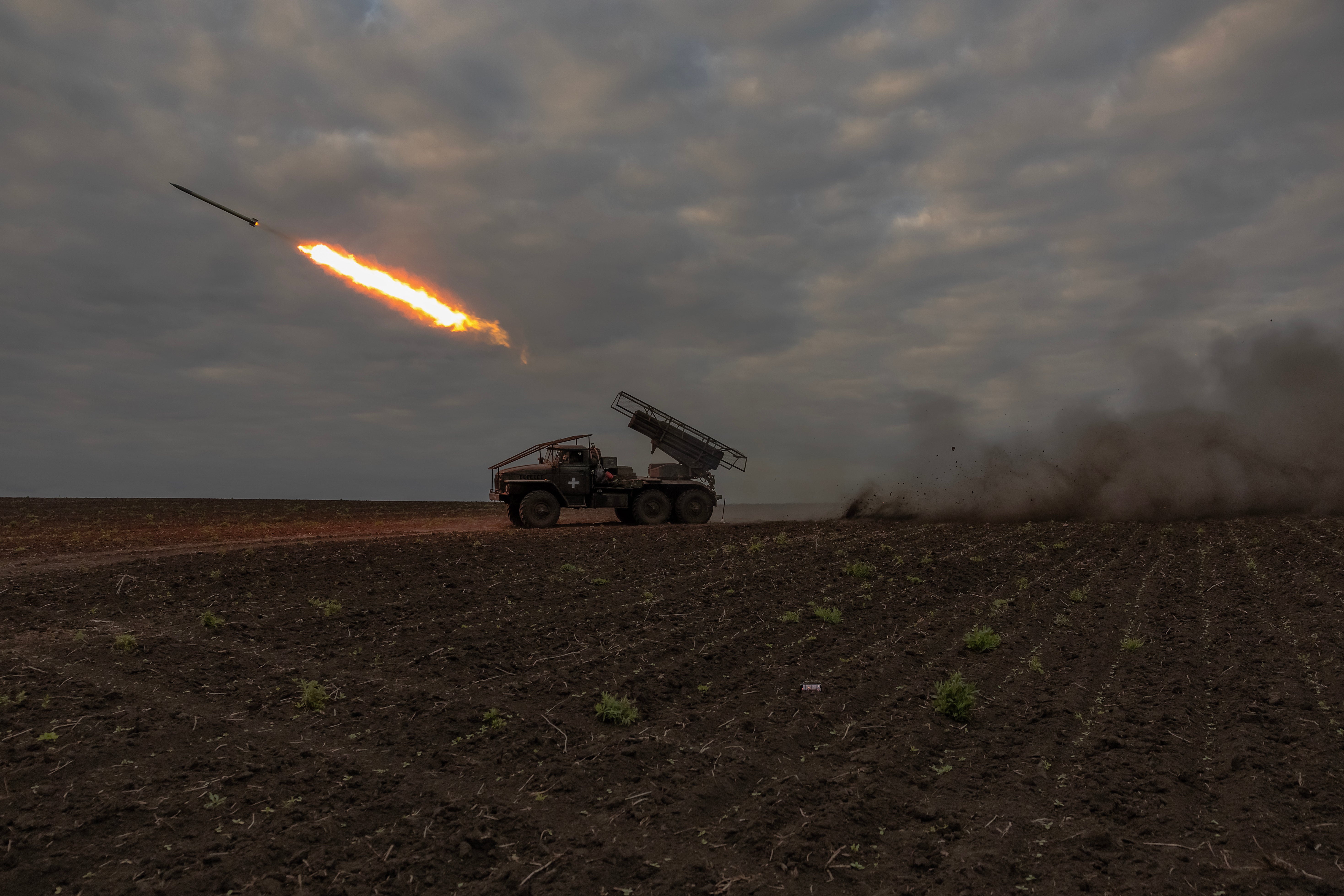 Ukrainian servicemen of the 92nd Assault Brigade fire BM-21 'Grad' multiple rocket launcher toward Russian positions, in the Kharkiv region
