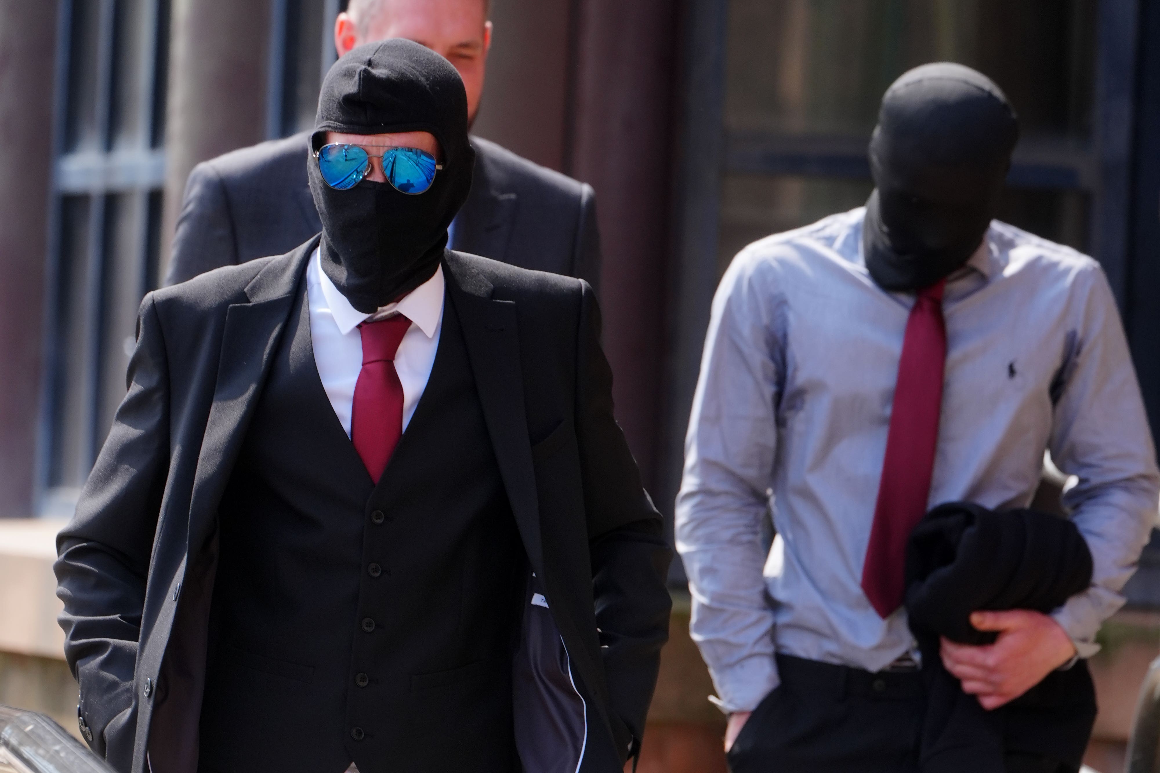 Daniel Graham, left, and Adam Carruthers, right, wore masks outside court (Owen Humphreys/PA)
