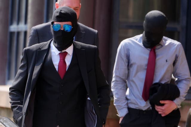 <p>Daniel Graham, left, and Adam Carruthers, right, wore masks outside court at a previous hearing over the felled Sycamore Gap tree (Owen Humphreys/PA)</p>