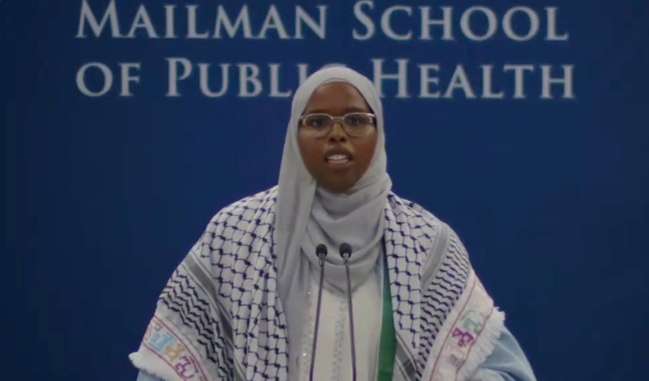 Saham David Ahmed Ali, pictured speaking at the Columbia University Mailman School of Public Health graduation ceremony, had her microphone cut out twice during her speech