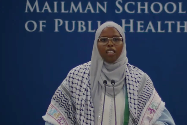 <p>Saham David Ahmed Ali, pictured speaking at the Columbia University Mailman School of Public Health graduation ceremony, had her microphone cut out twice during her speech</p>
