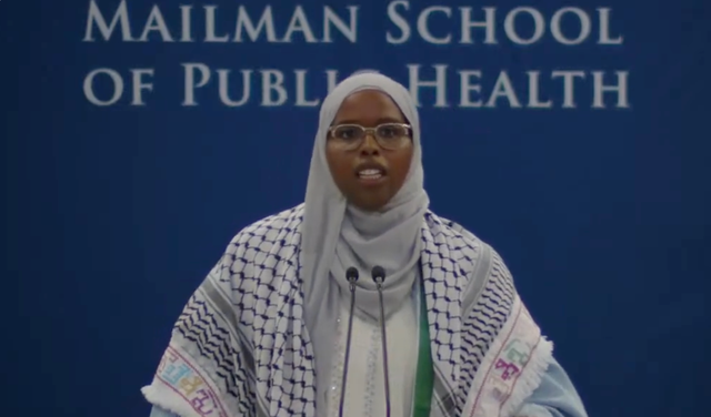 <p>Saham David Ahmed Ali, pictured speaking at the Columbia University Mailman School of Public Health graduation ceremony, had her microphone cut out twice during her speech</p>