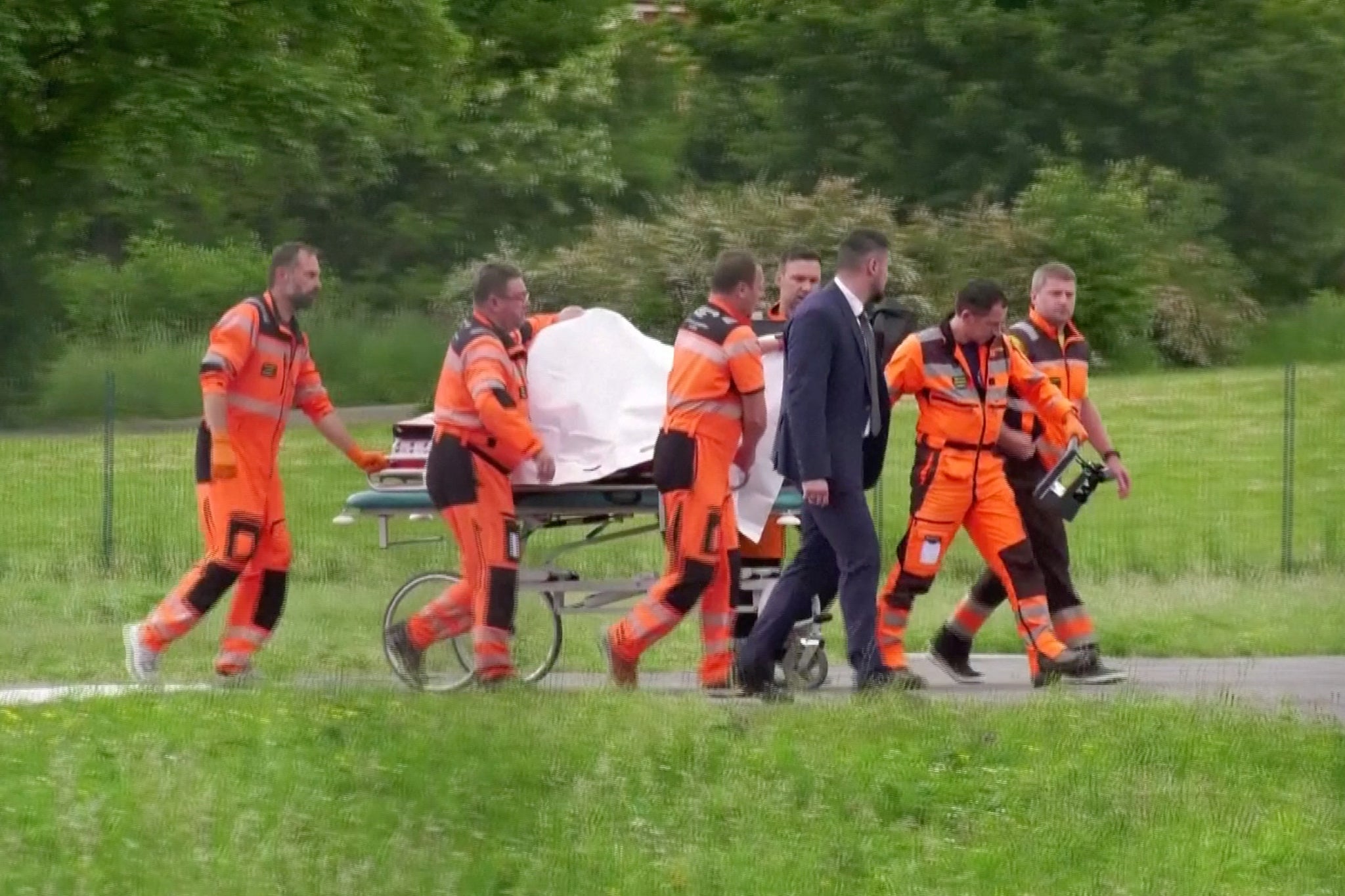 Medical personnel carry Slovakia’s Prime Minister Robert Fico to hospital after being transported in a helicopter, in Banska Bystrica, Slovakia, May 15, 2024