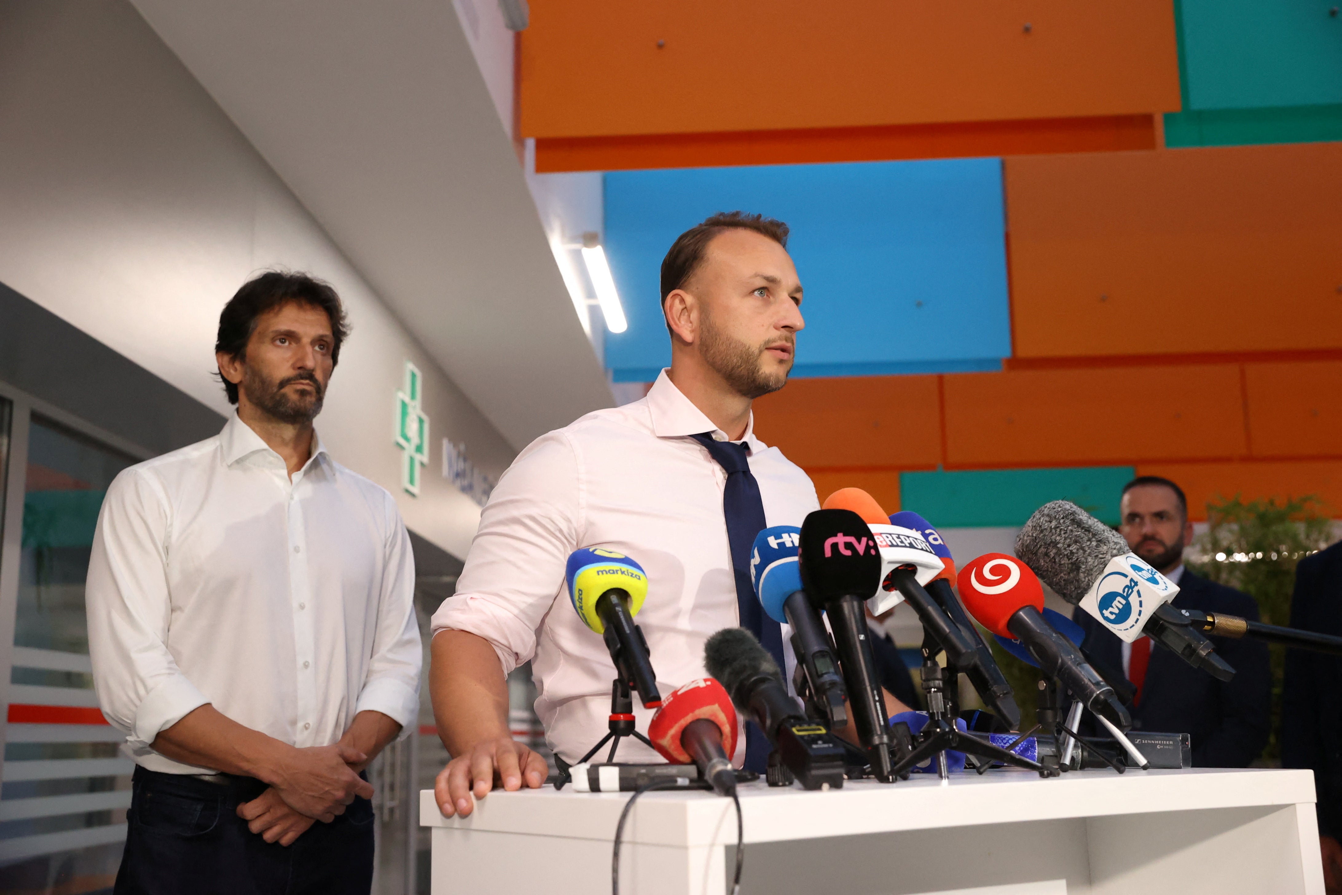 Slovak Interior Minister Matus Sutaj Estok, flanked by Defence Minister Robert Kalinak, speaks during a press conference