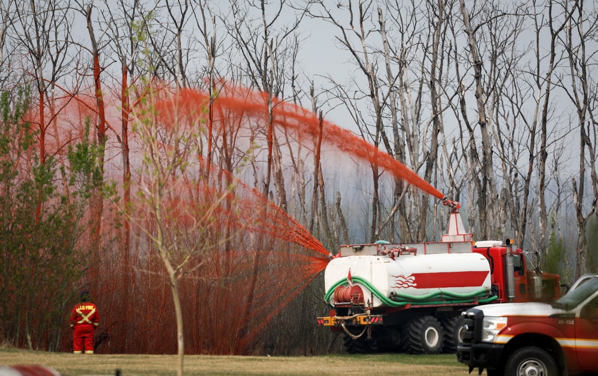 Canadians are hopeful shifting winds may push wildfire away from the oil sands hub of Fort McMurray
