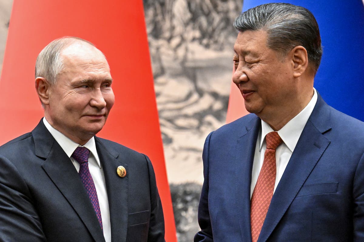 Putin and Xi Jinping laud world stabilising influence at Beijing talks