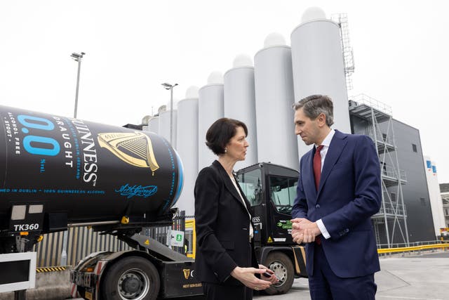 Taoiseach Simon Harris speaks with Diageo chief executive officer Debra Crew while visiting the Guinness Brewery (Naoise Culhane/PA)