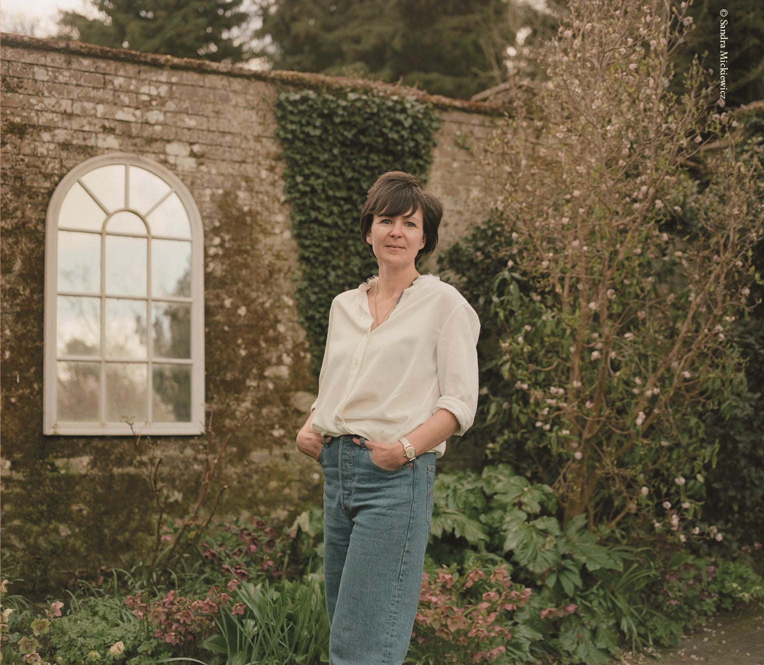 Olivia Laing in their Suffolk garden