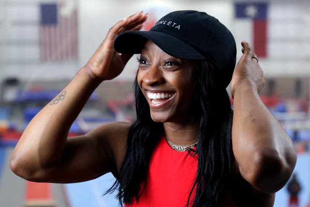<p>Olympic gold medalist Simone Biles Owens is interviewed after training at the Stars Gymnastics Sports Center in Katy, Texas, Monday, Feb. 5, 2024</p>