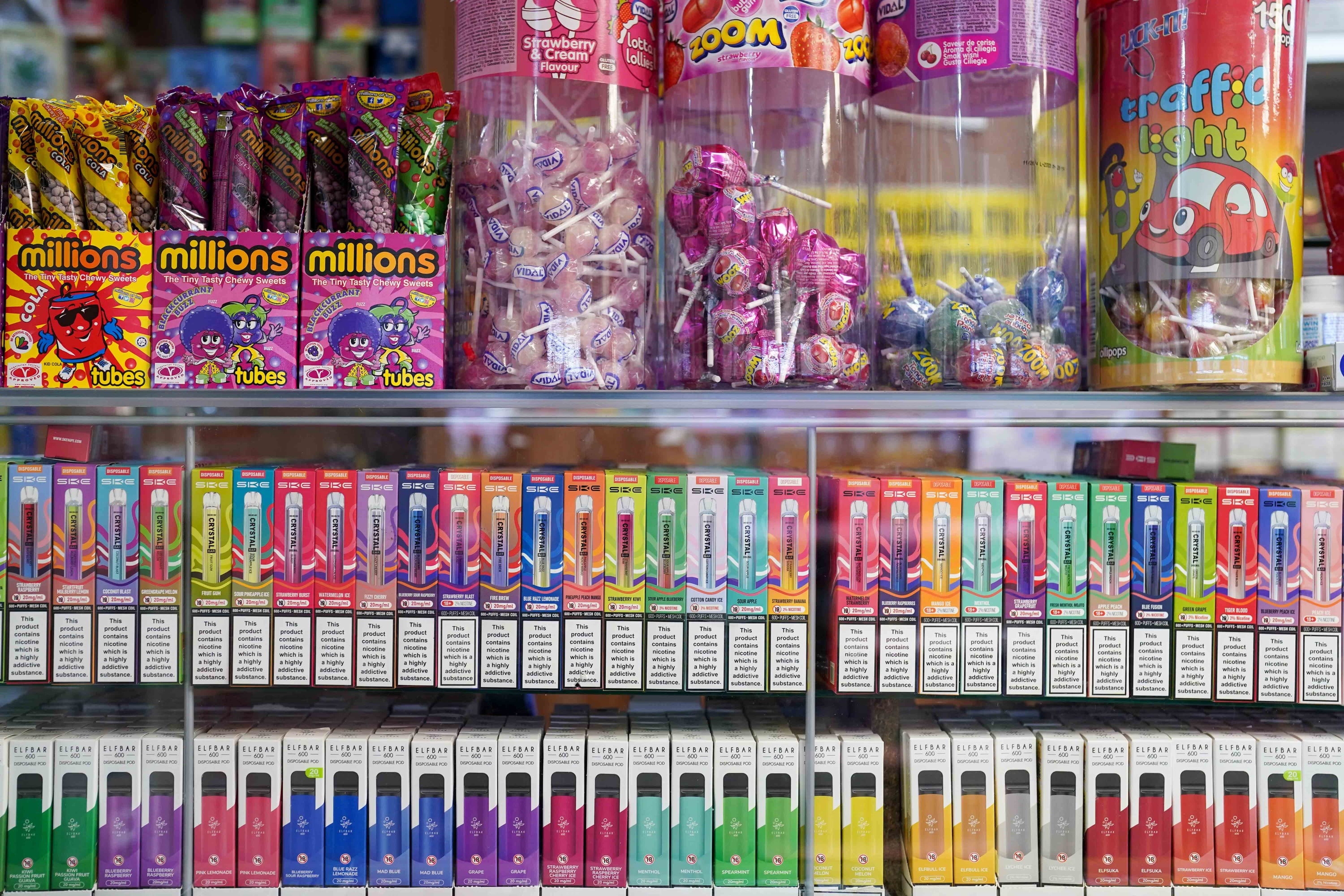 Vape flavours next to sweets in a shop