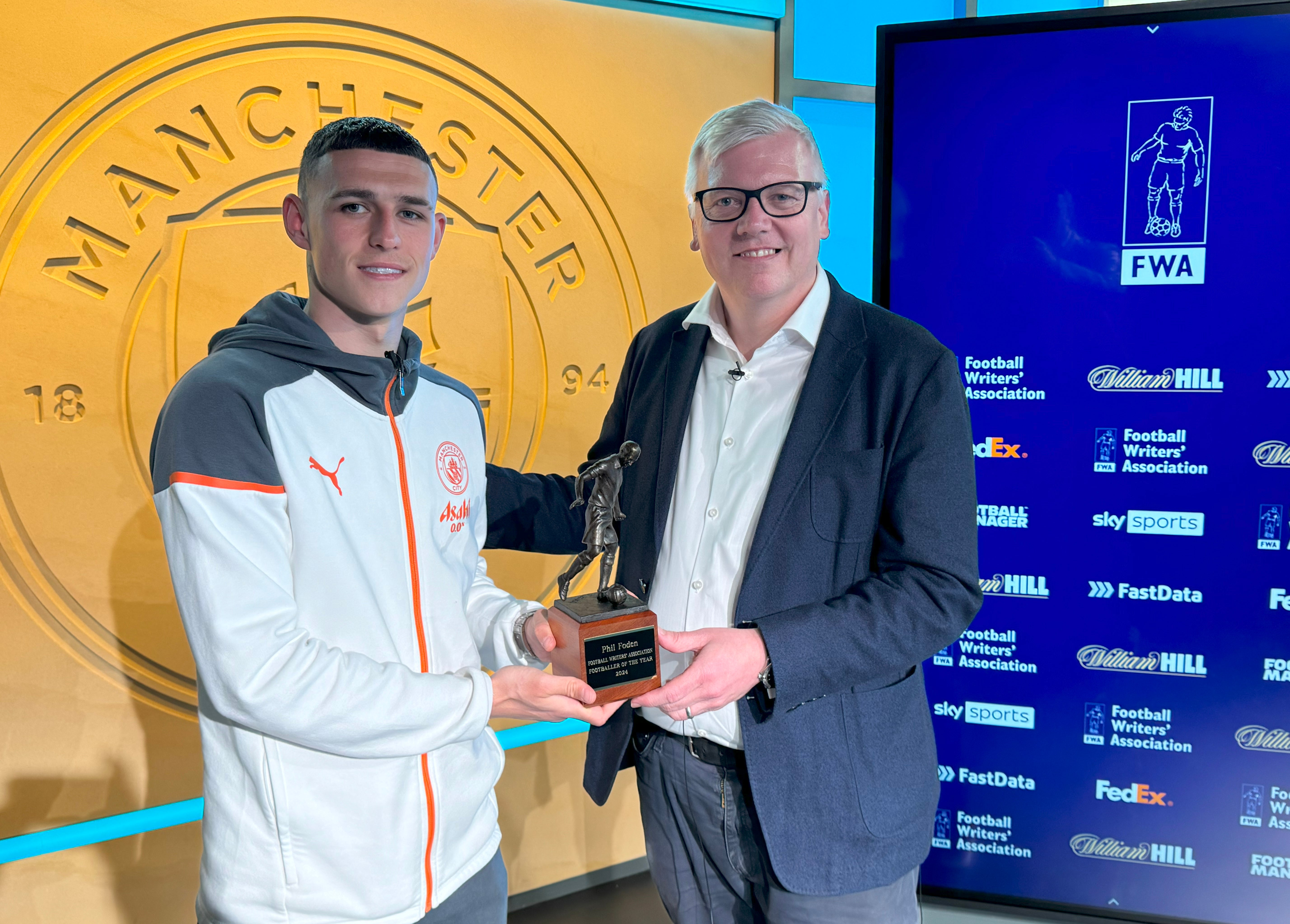 Phil Foden was presented his trophy by FWA Chair John Cross.