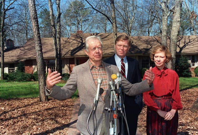 <p>Jimmy Carter (left) pictured with his wife Rosalynn Carter (right) outside their Plains, Georgia home in 1988. The Carters lived in a home valued at just $167,000 after they left the White House, the Washington Post reports</p>