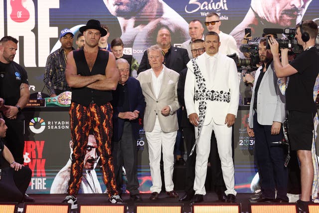 <p>Tyson Fury (centre left) and Oleksandr Usyk at Thursday’s press conference for their fight</p>