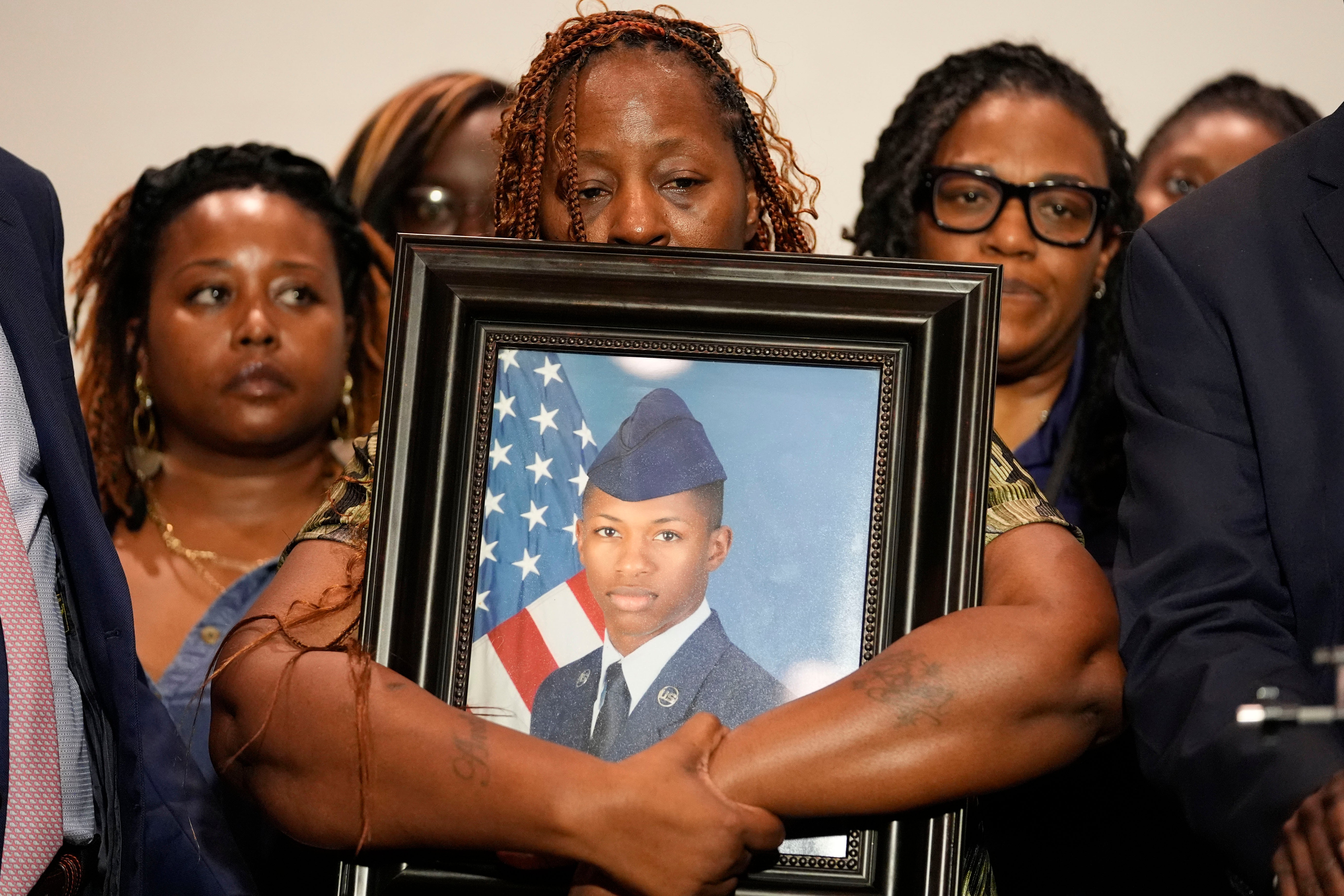 Chantemekki Fortson, mother of Roger Fortson, holds a photo of her son during a news conference