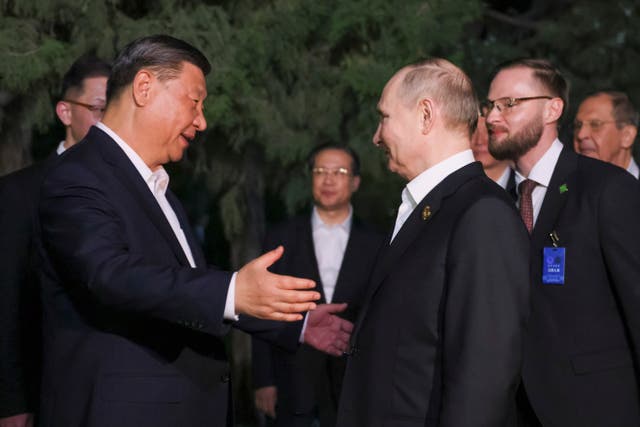 <p>Xi Jinping extends arms to hug Vladimir Putin in Beijing  </p>