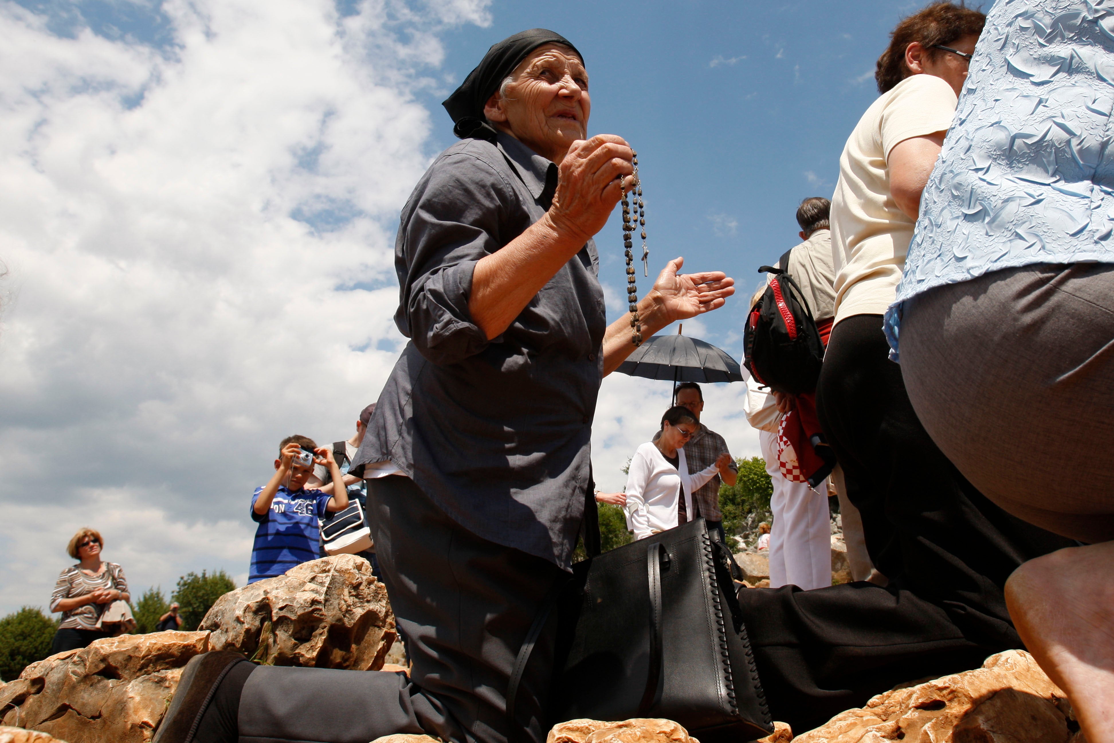 Pilgrims say prayers at the ‘Hill of Appearance’ in the southern-Bosnian town of Medjugorje
