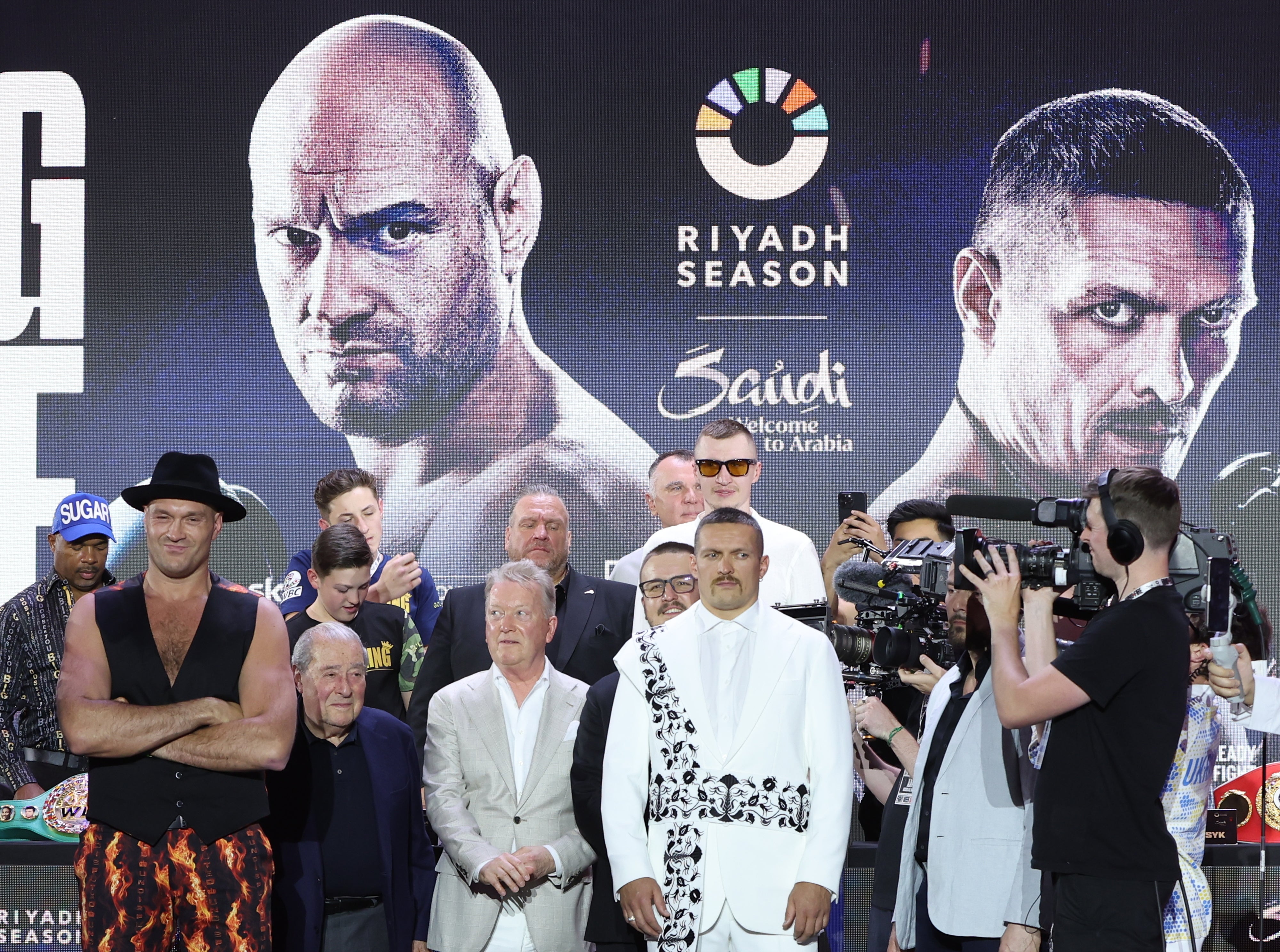 British boxer Tyson Fury (L) and Oleksandr Usyk (C-R) of Ukraine pose after attending a press conference in Riyadh, Saudi Arabia