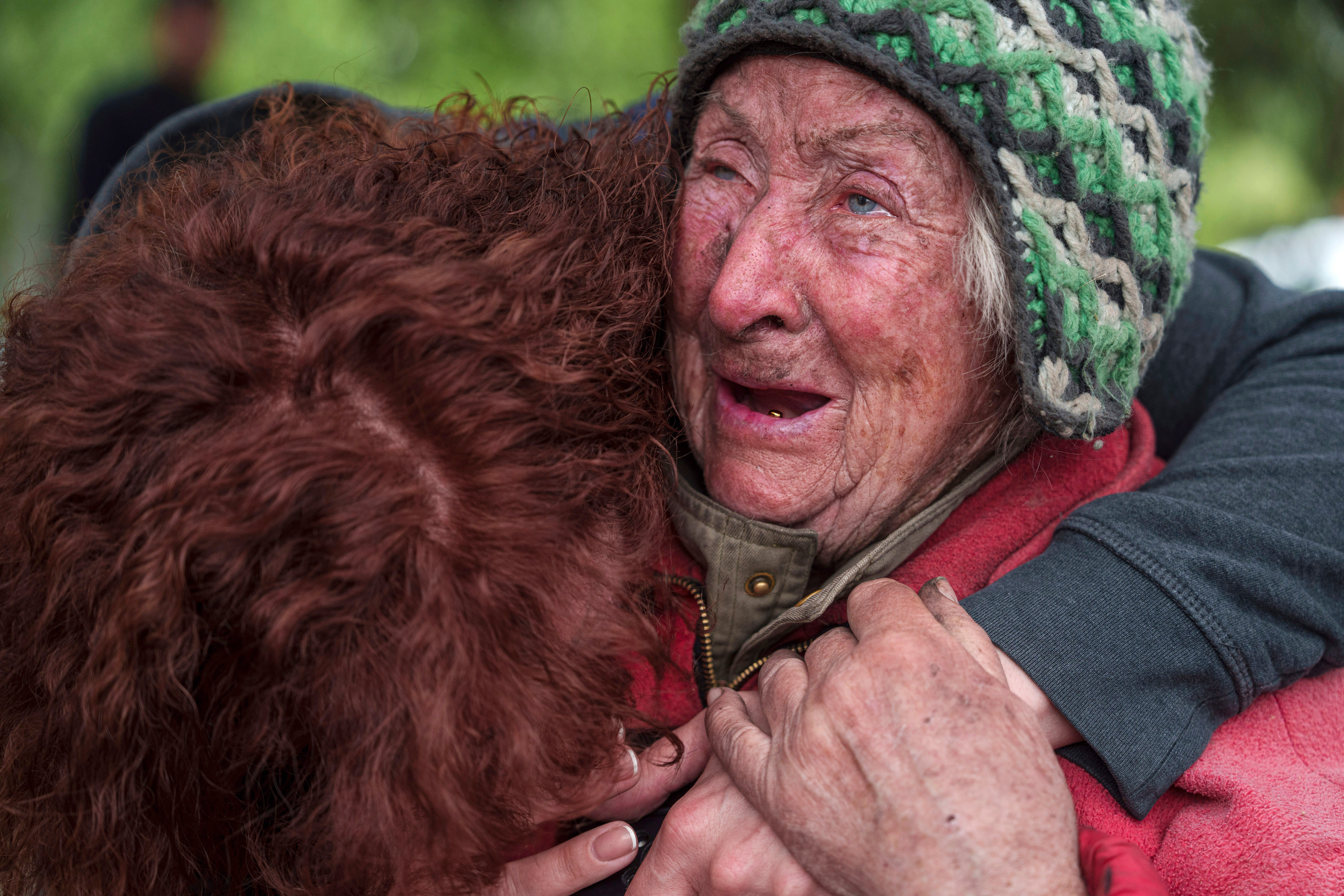 Tetiana, 82, cries with her daughter as she is evacuated from Vovchansk, Ukraine, last weekend