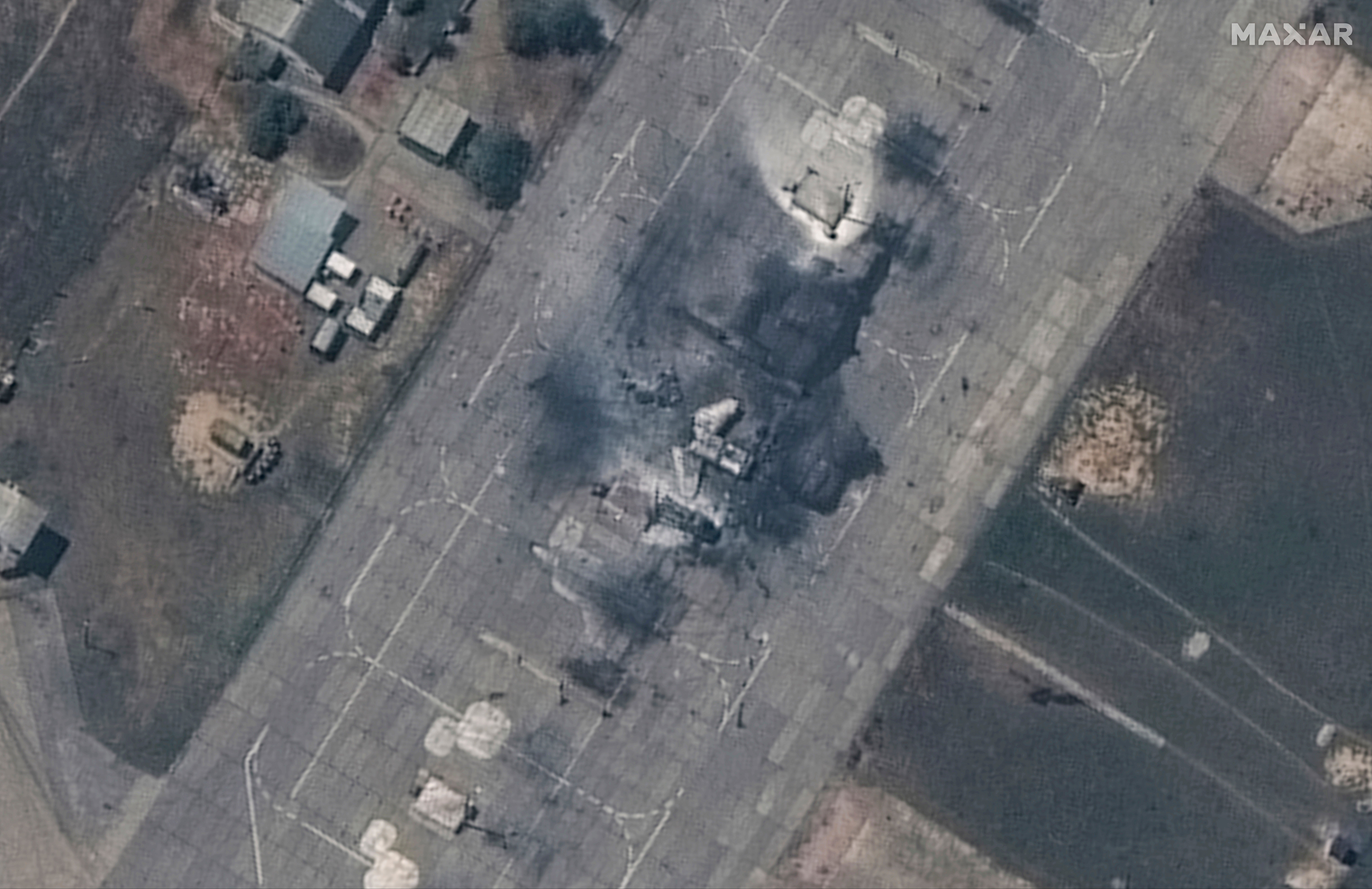 This image released by Maxar Technologies shows a closer view of a destroyed MiG 31 fighter aircraft at Belbek air base, near Sevastopol, in Crimea,
