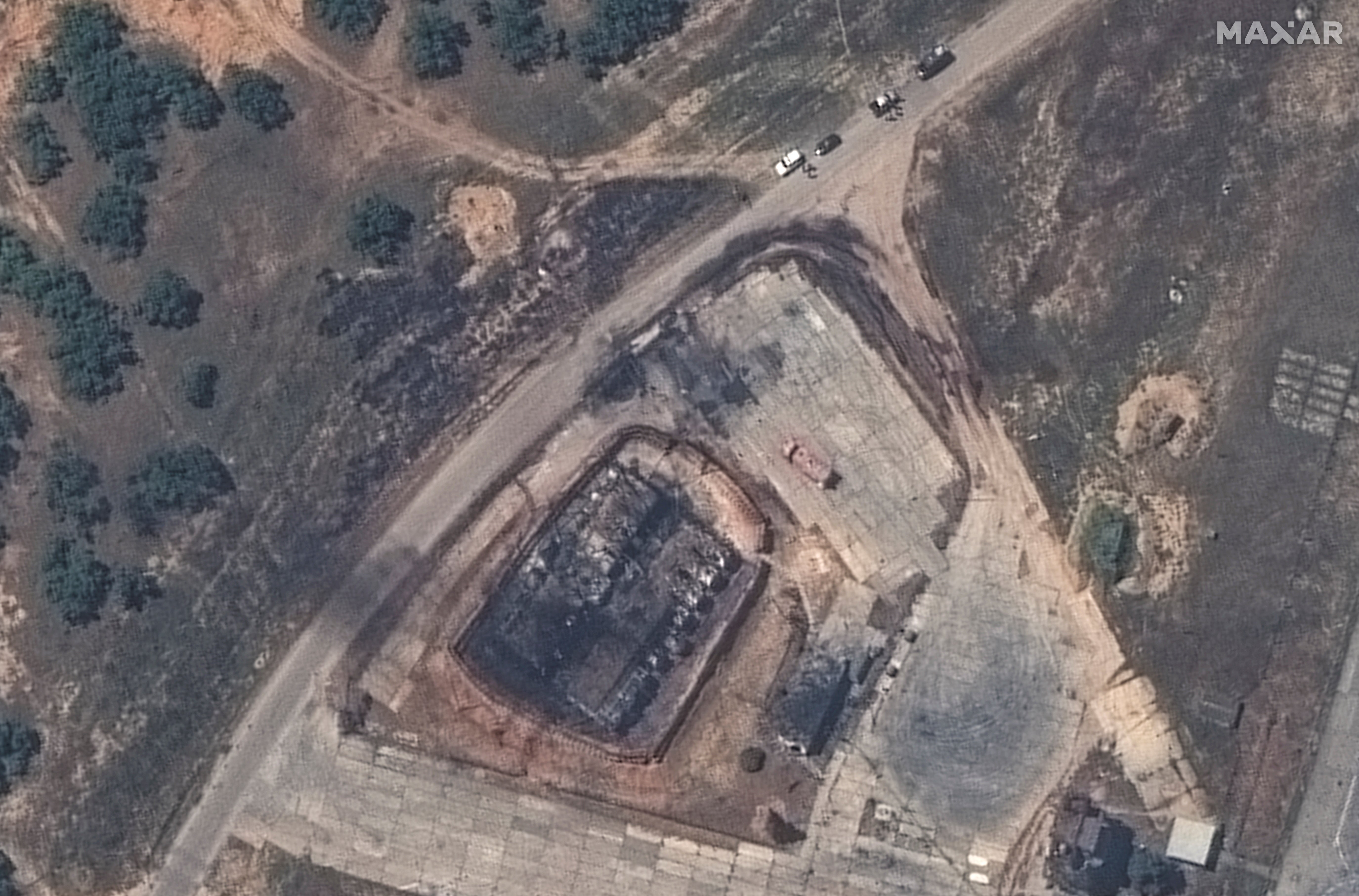 A satellite image of a destroyed fuel storage facility following an attack at Belbek Airbase