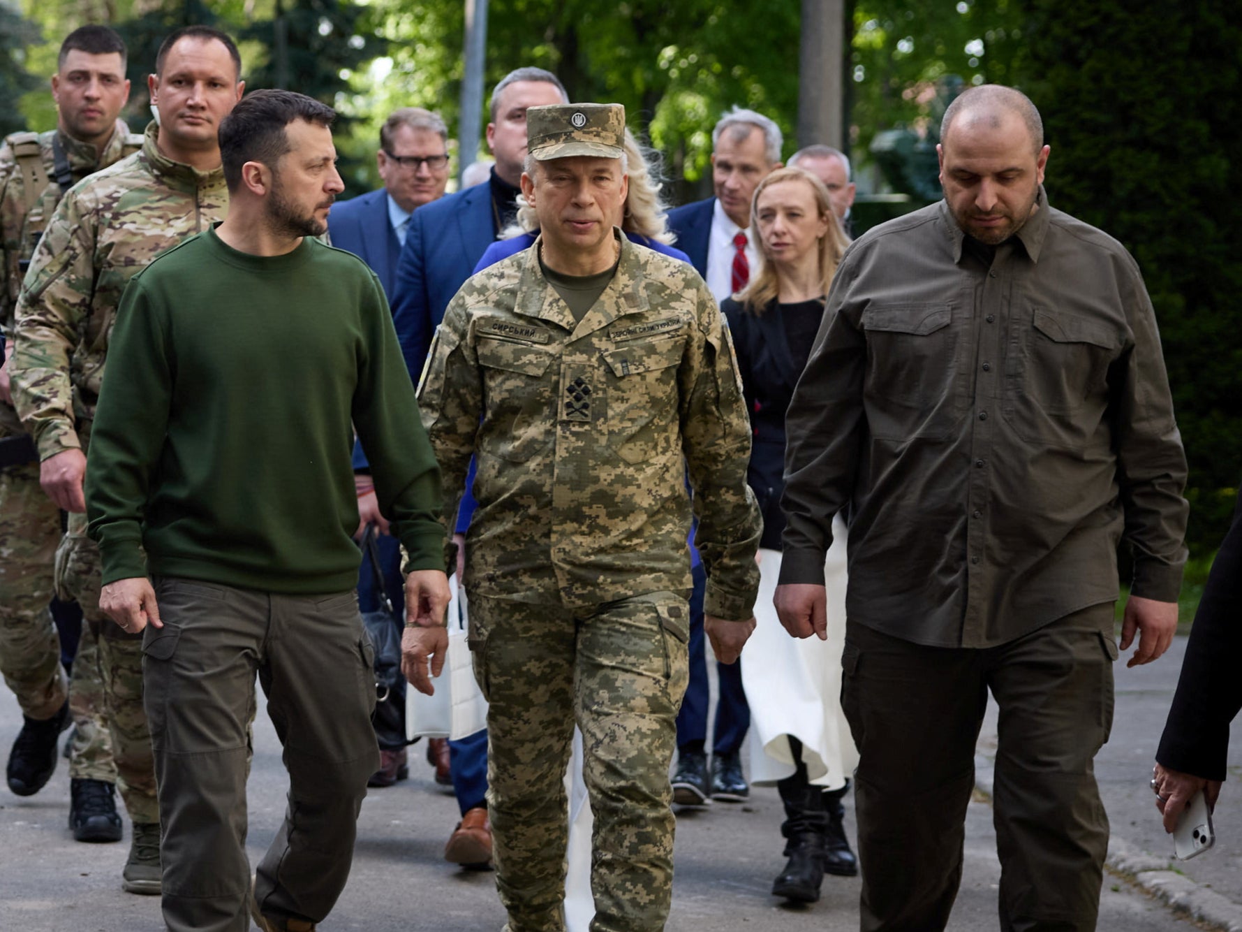 Ukrainian President Volodymyr Zelensky, Army chief Oleksandr Syrski and defence minister Rustem Umerov walk together in Kyiv last month