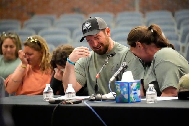 <p>James Herling, seated next to his wife Nicole Herling, pauses his testimony while recalling the moment he realized the shooter was his brother-in-law, Robert Card, while testifying in Thursday</p>