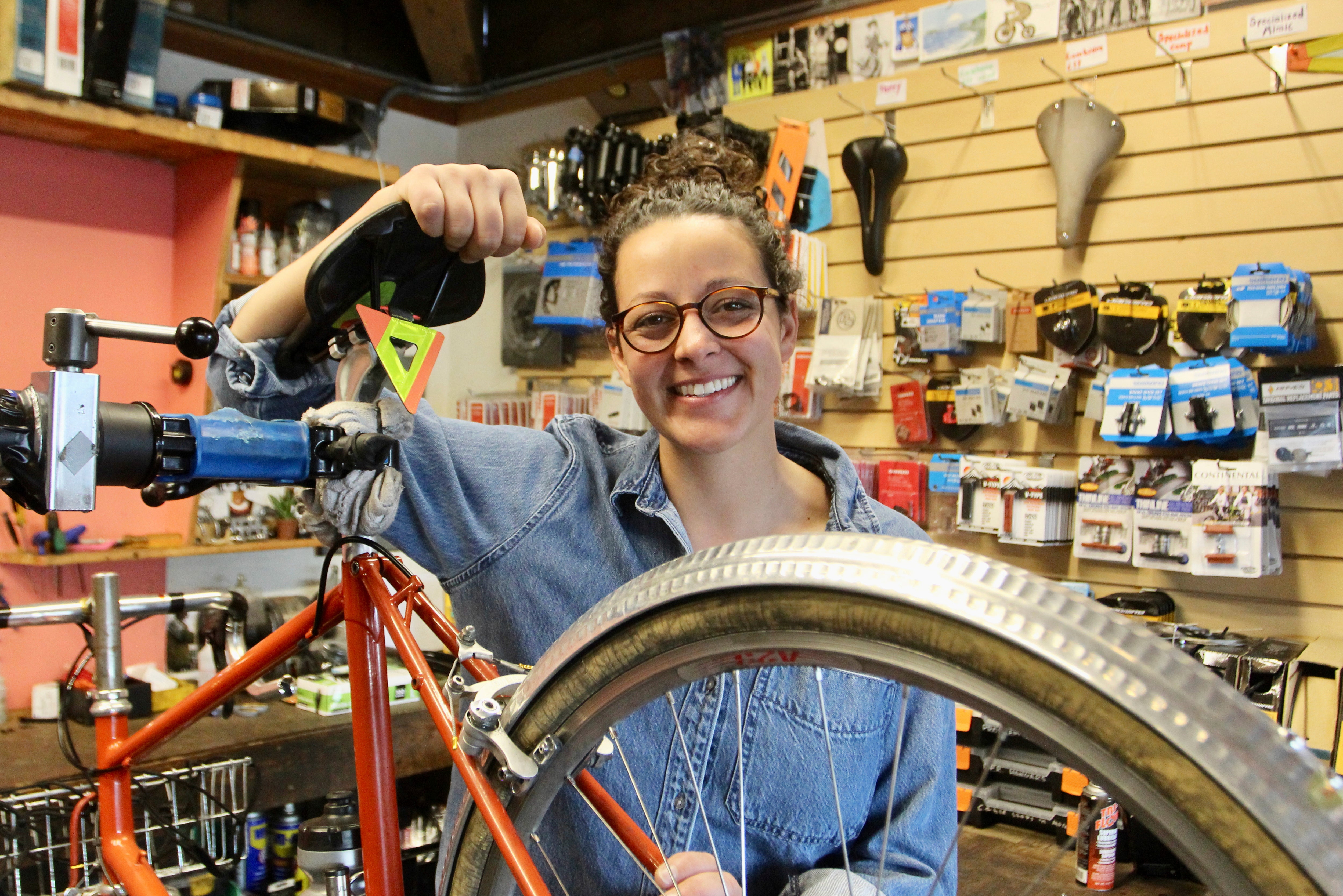 Shawna Williams, owner of Free Range Cycles, poses in her shop on May 6, 2024