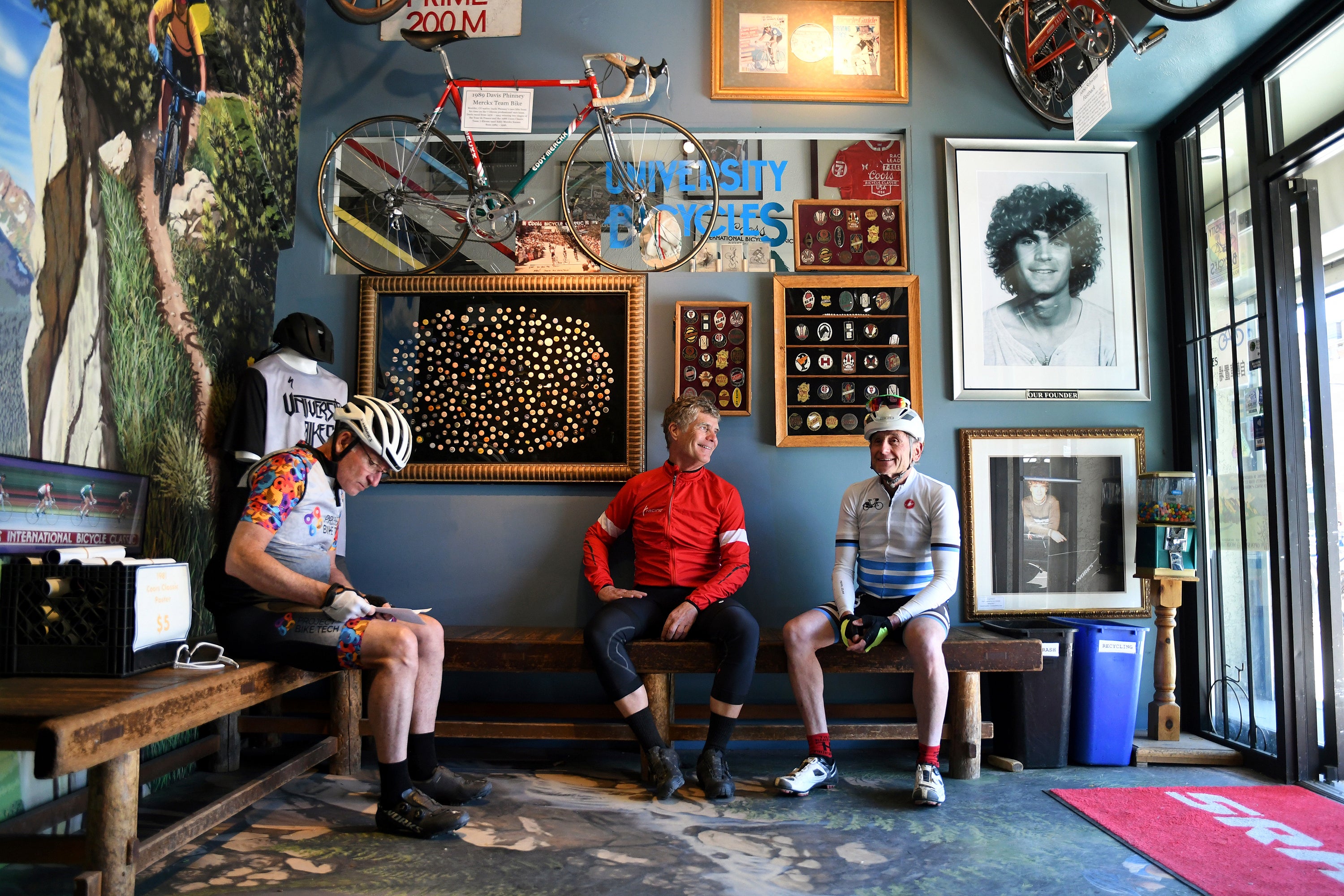 University Bicycles owner Douglas Emerson, center, talks with friends in his shop in Boulder