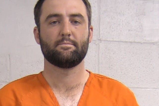 <p>A photo made available by the Louisville Police Department showing golfer Scottie Scheffler after his arrest </p>