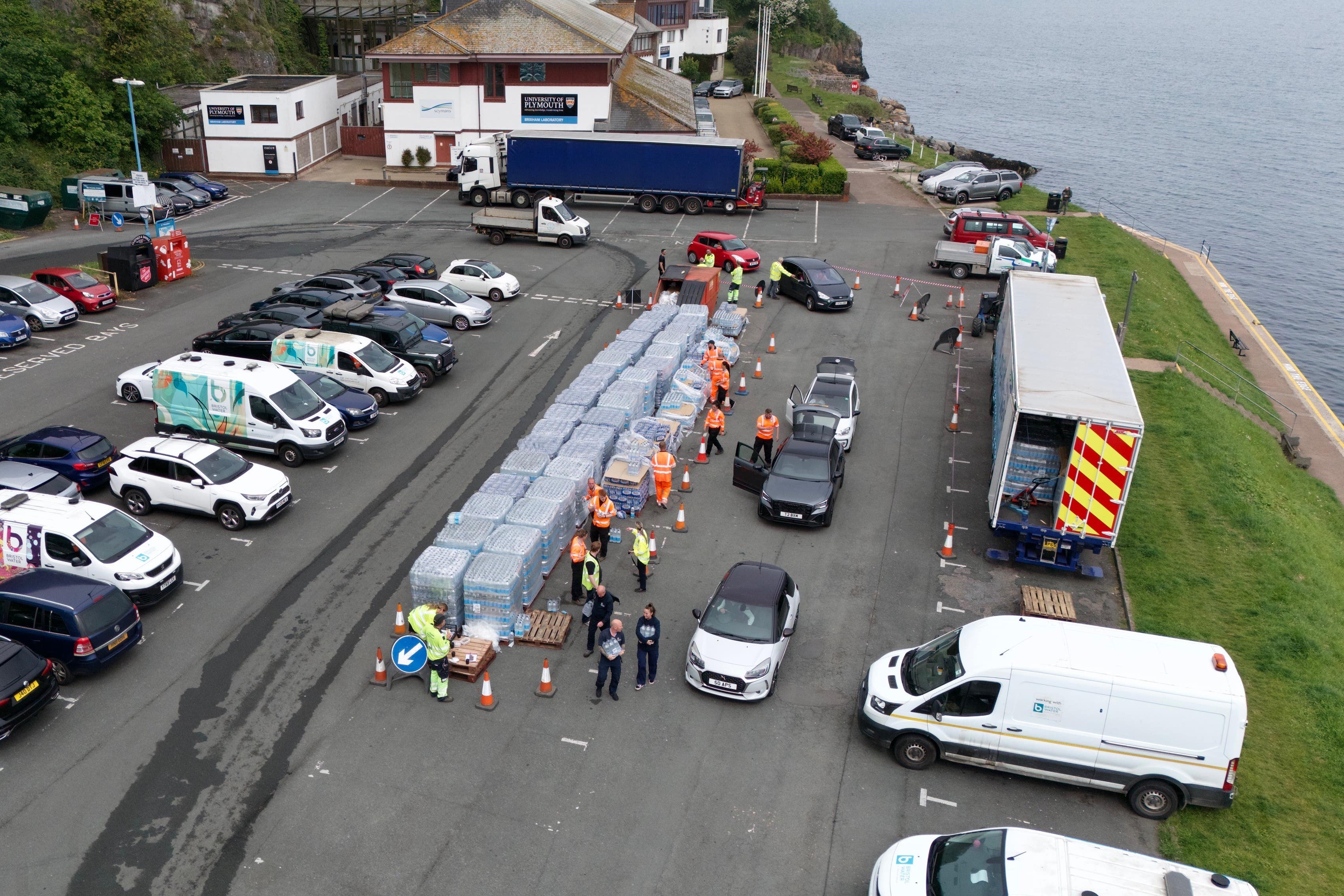 Residents have been collecting bottled water at Freshwater car park (Ben Birchall/PA)