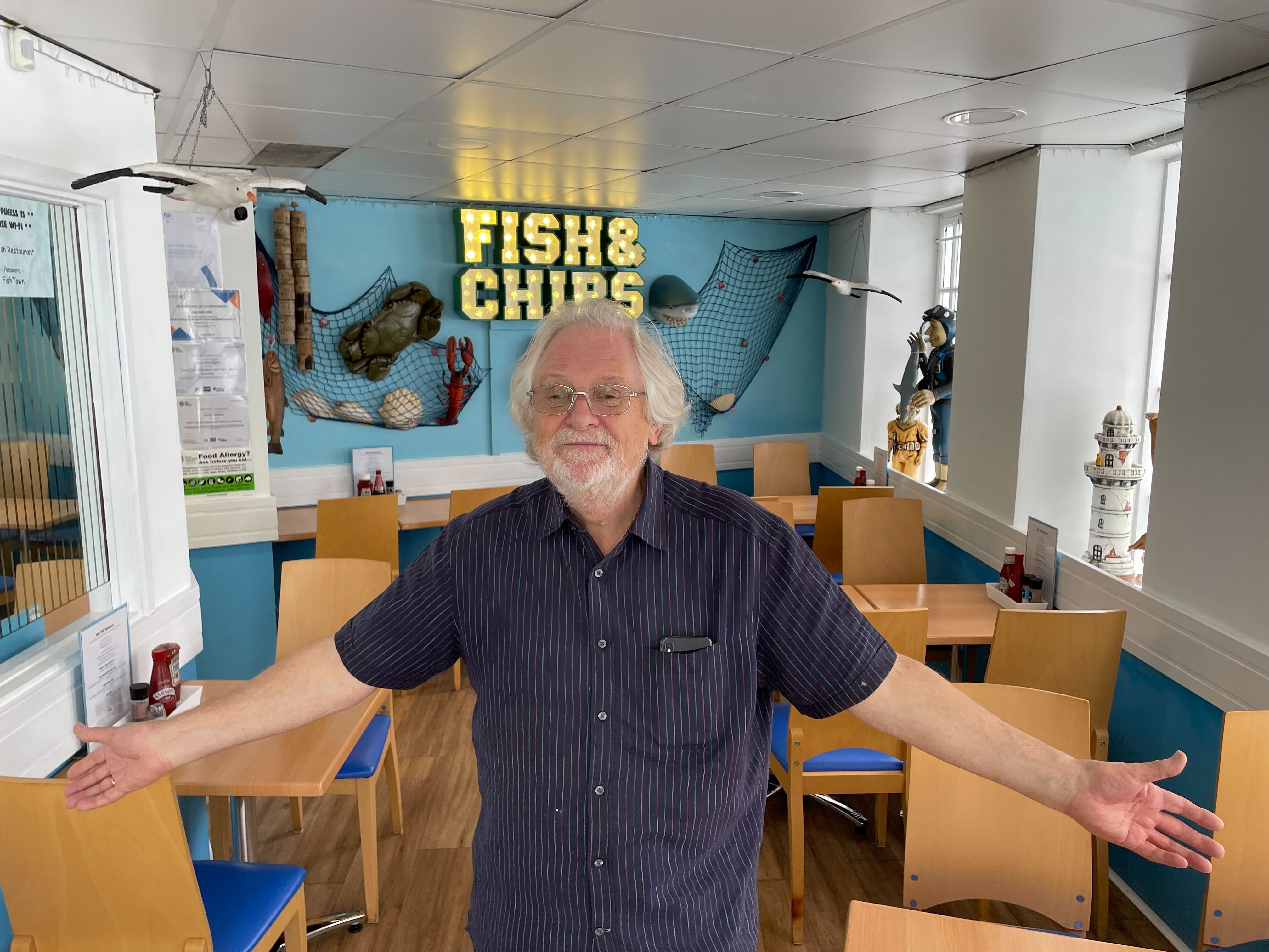 Where are the customers? Keith Johnson stands in his fish and chip shop in Brixham where he’s served no-one in first hour-and-a-half of opening on Friday lunchtime