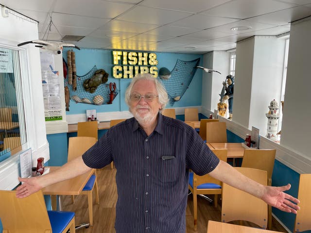 <p>Where are the customers? Keith Johnson stands in his fish and chip shop in Brixham where he’s served no-one in first hour-and-a-half of opening on Friday lunchtime</p>