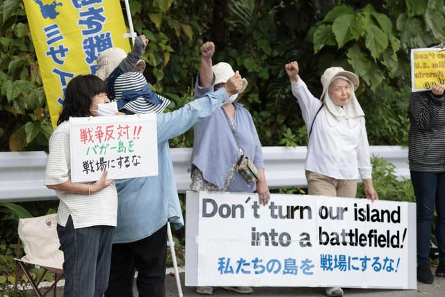 <p>People protest against a visit by US Ambassador to Japan Rahm Emanuel, near a military post of the Japan Ground Self-Defense Force on Ishigaki Island</p>
