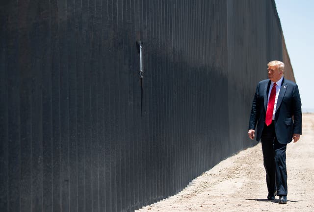 <p>Donald Trump participates in a ceremony commemorating the 200th mile of border wall at the international border with Mexico in San Luis, Arizona, 23 June 2020</p>