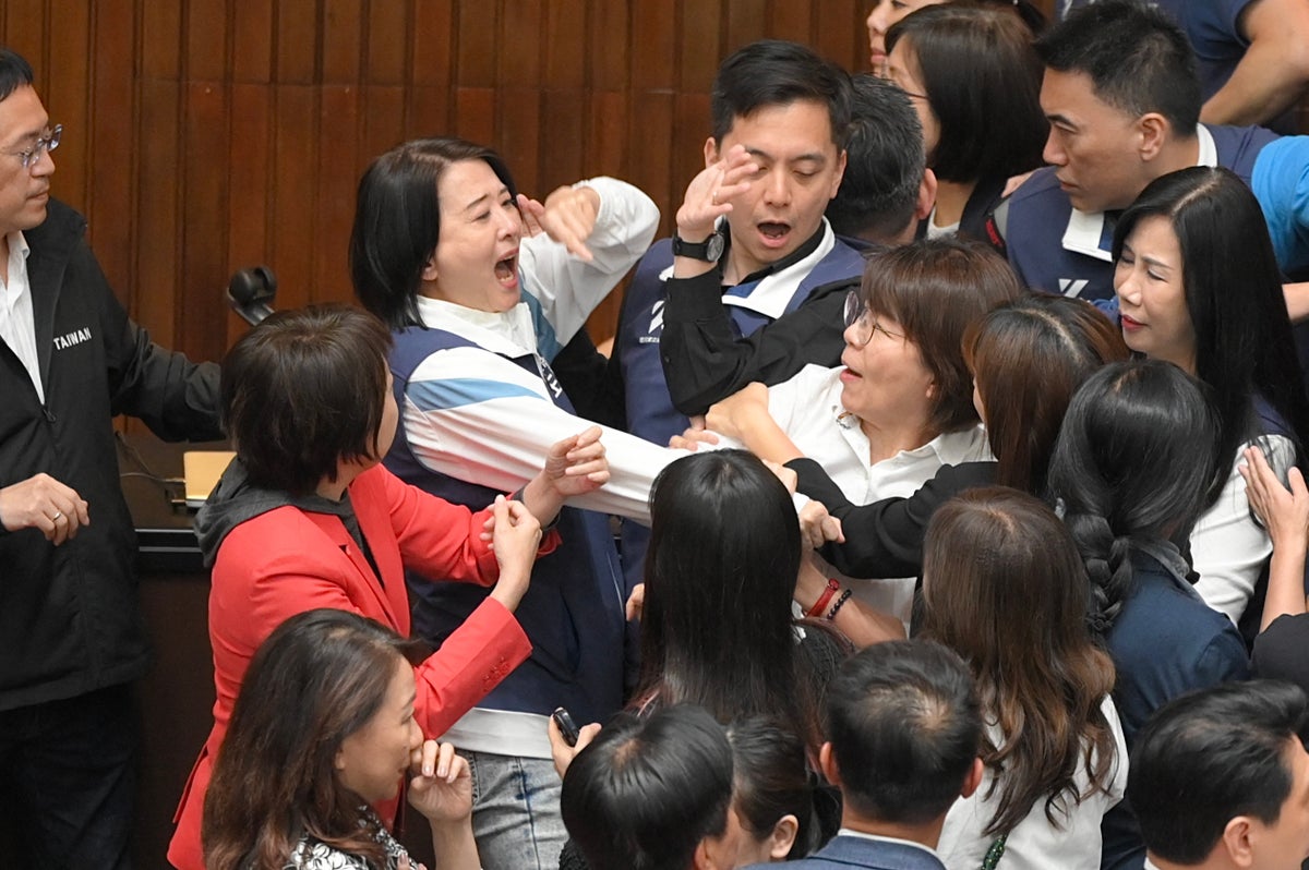 Taiwan parliament brawl escalates into night as lawmakers shove, tackle and hit each other