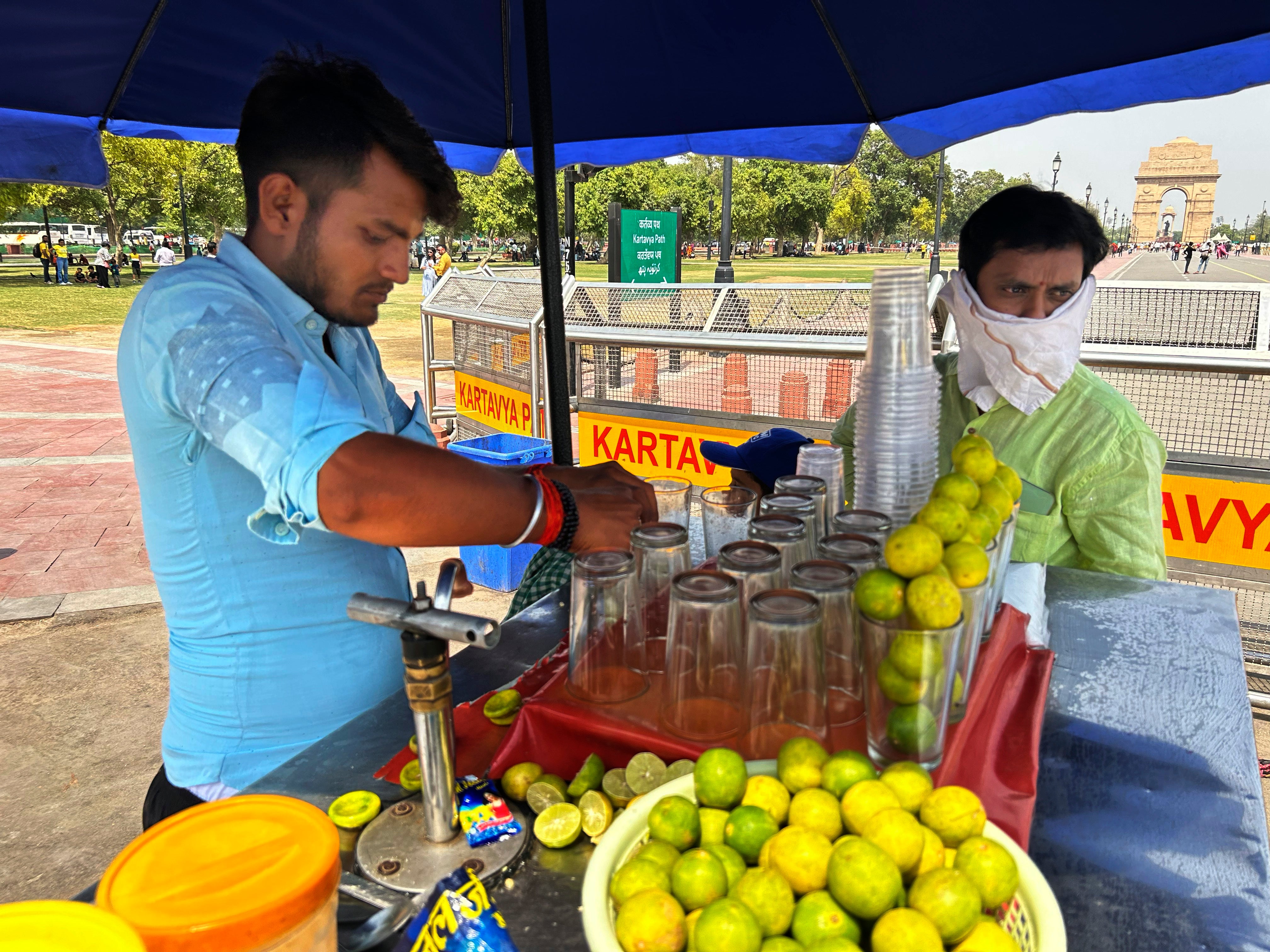 A roadside vendor sells iced lemonade in New Delhi
