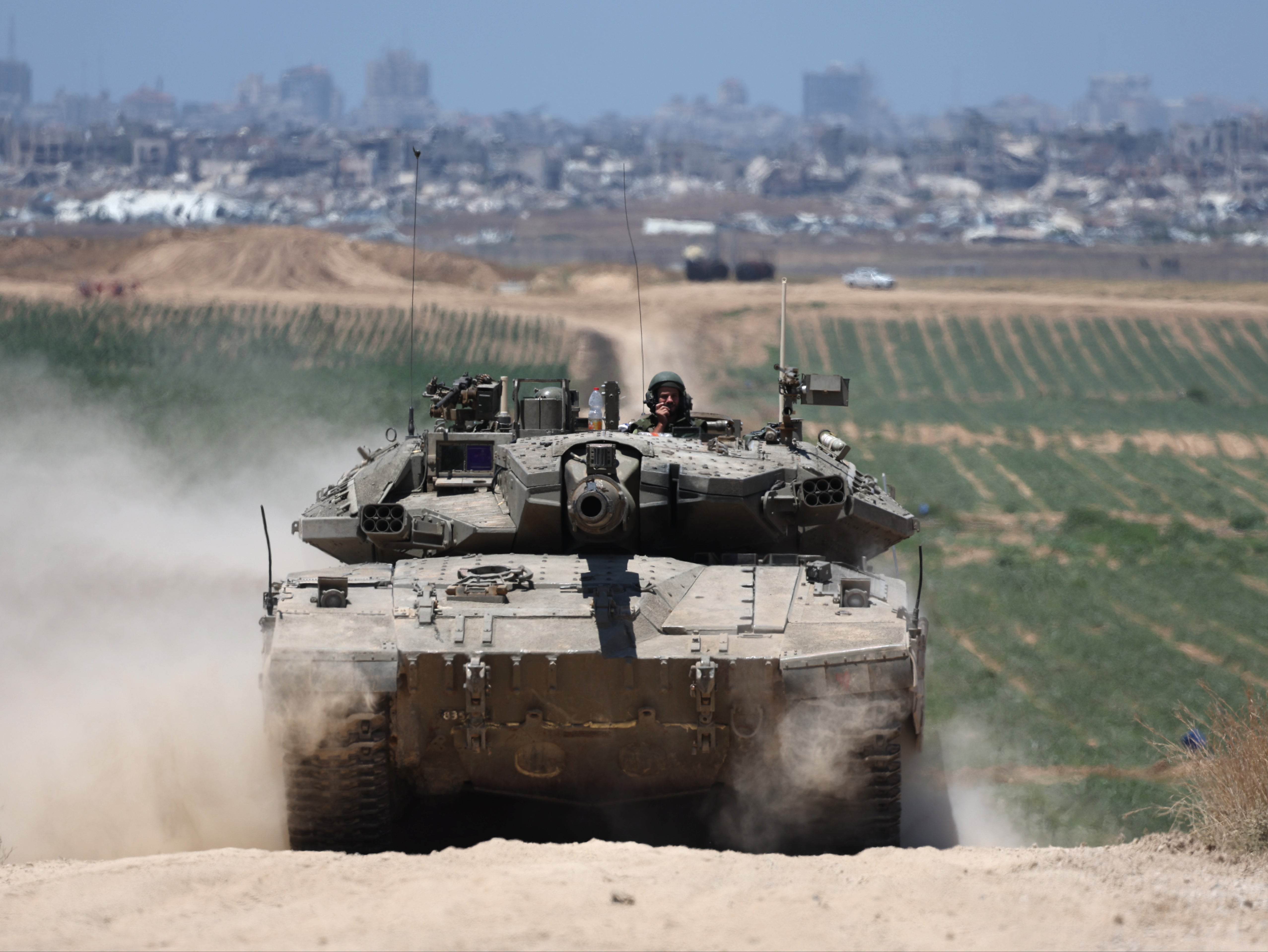 Israeli tanks patrol near the security fence with Jabalia in the northern part of the Gaza Strip
