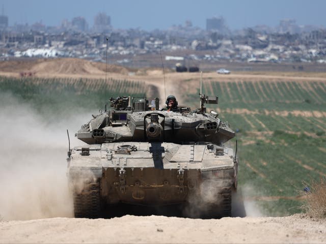<p>Israeli tanks patrol near the security fence with Jabalia in the northern part of the Gaza Strip</p>