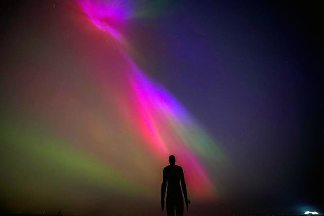 The Northern Lights, glowed on the horizon at Another Place by Anthony Gormley, Crosby Beach, Liverpool last week (Peter Byrne/PA)