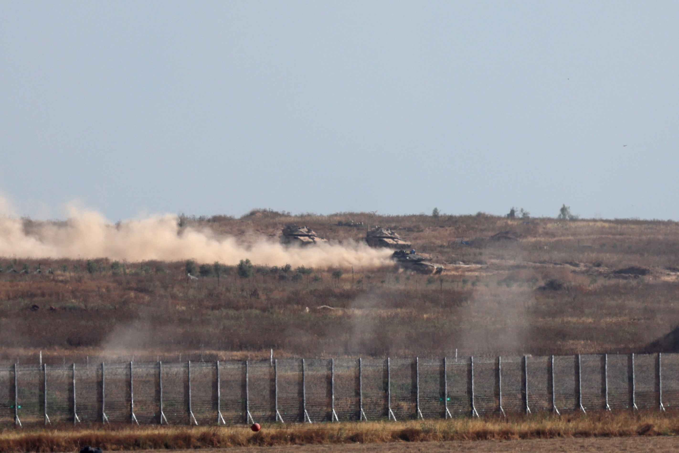 Israeli tanks drive across the security fence with Jabalia in northern part of the Gaza Strip
