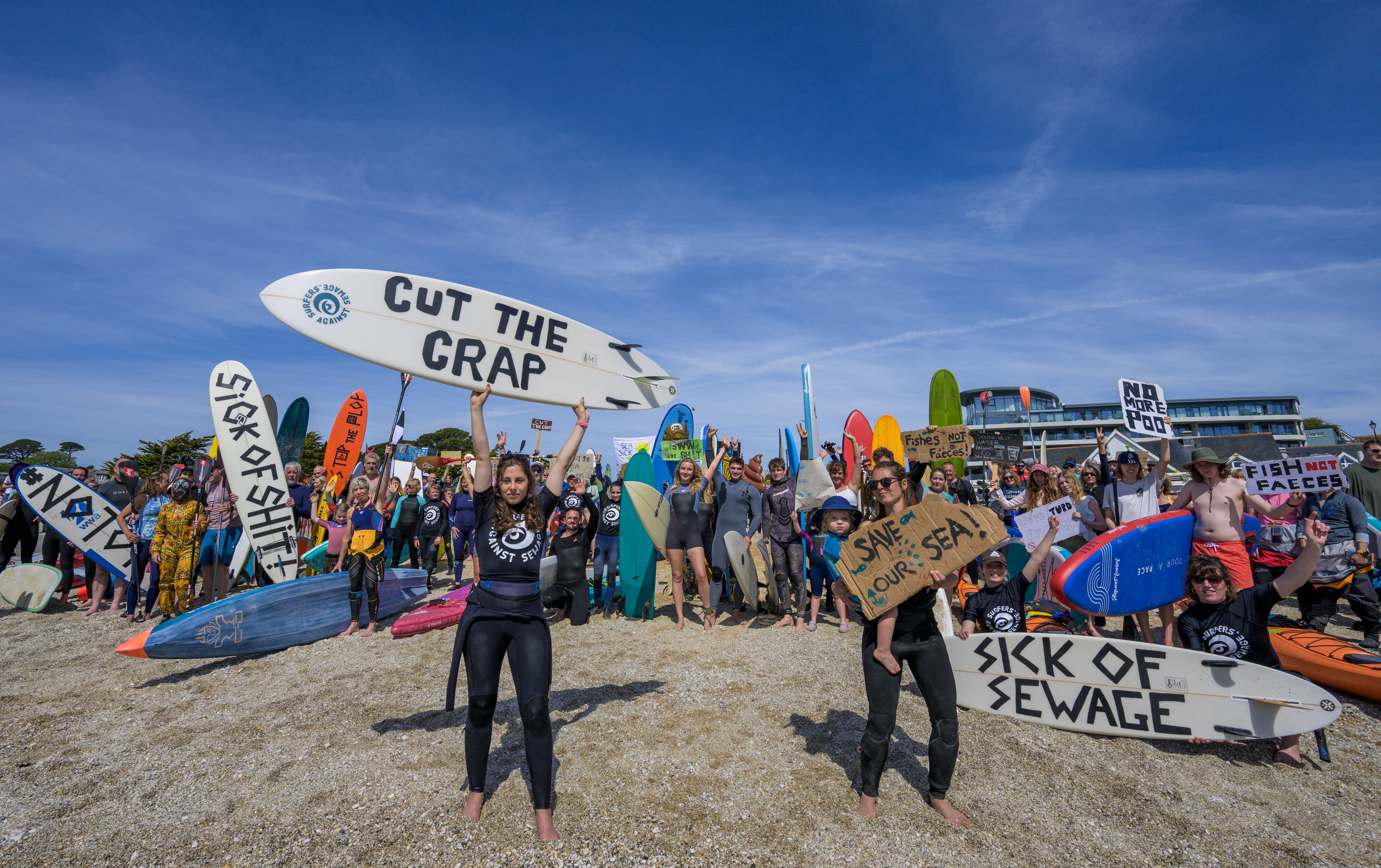 People take part in a protest by Surfers Against Sewage (SAS), in Falmouth